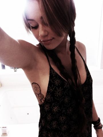 miley cyrus tattoo dreamcatcher. Miley Cyrus took to twitter to